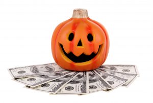Halloween pumpkin with money.