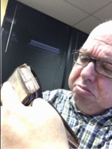 Fred looking at empty wallet