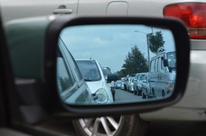 Side view mirror shows traffic jam
